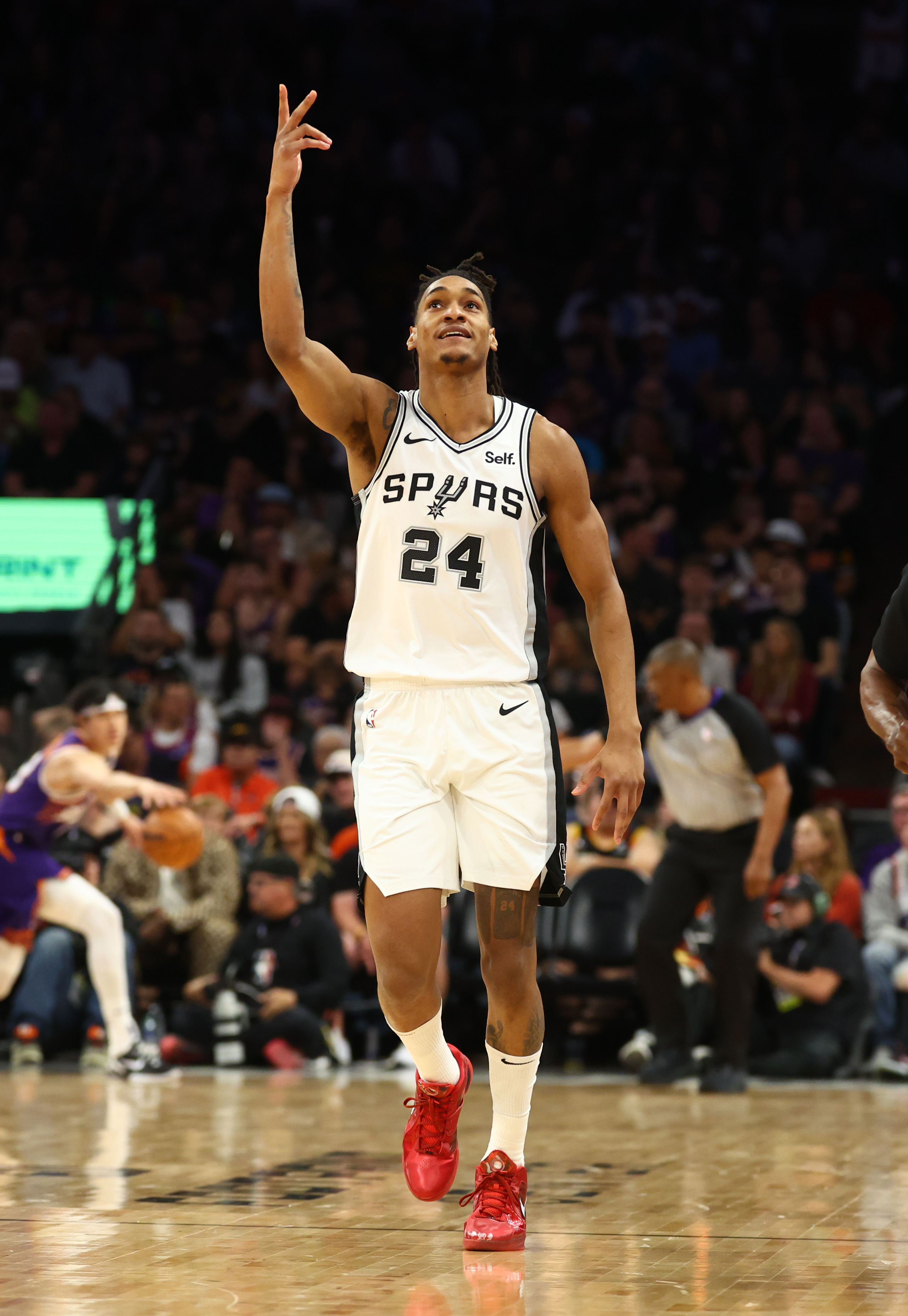 Nov 2, 2023; Phoenix, Arizona, USA; San Antonio Spurs guard Devin Vassell (24) against the Phoenix Suns at Footprint Center.